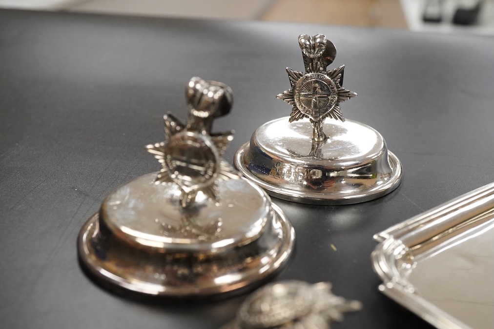 A pair of late Victorian Regimental silver menu holders (Royal Sussex Regiment), a pair of ashtrays and two pairs of uniform pips first height 5cm., weight approx. 7.83ozt